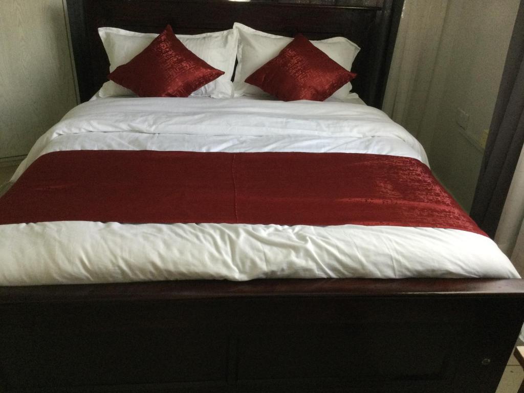 Postel nebo postele na pokoji v ubytování Milimani Comfort