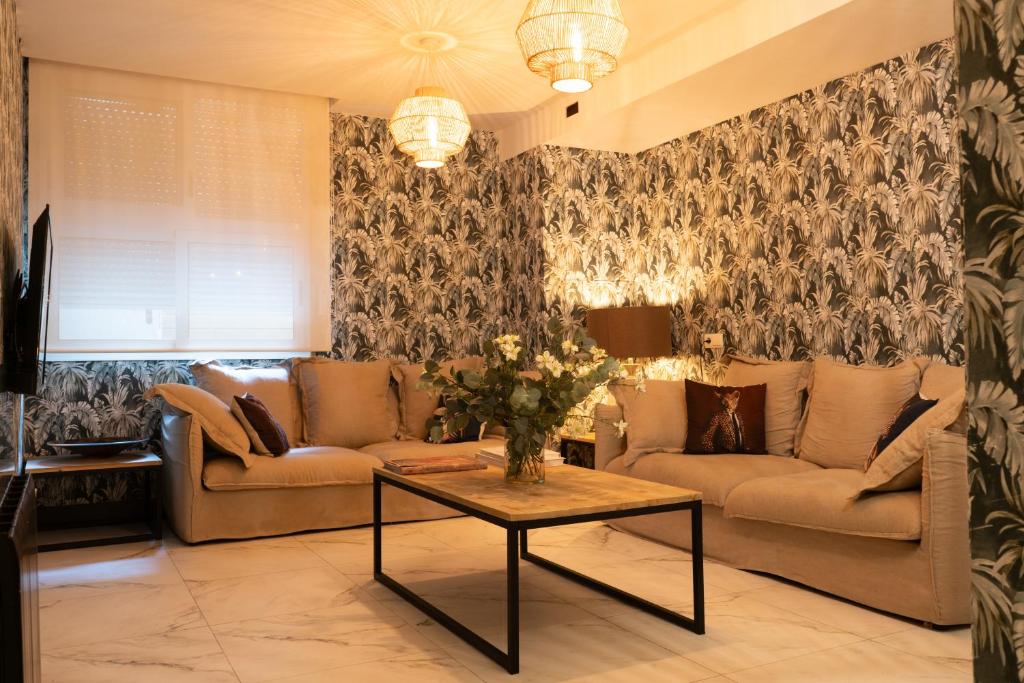 a living room with a couch and a table at Hotel Don Diego in Suances