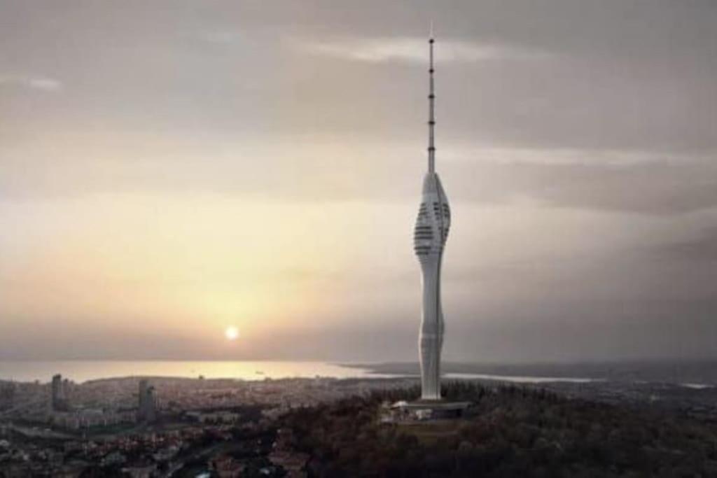 a tower on a hill with the sunset in the background at Best opportunity in emaar in Istanbul
