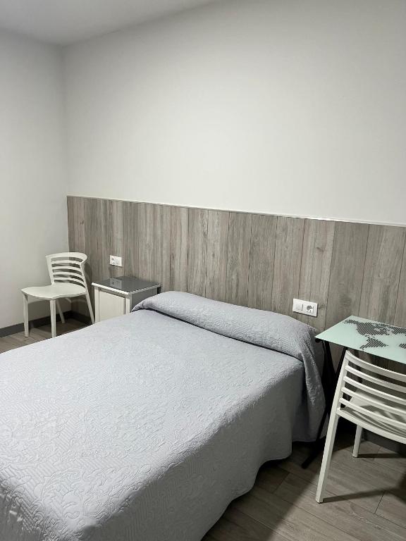 Postel nebo postele na pokoji v ubytování Hospederia del Pilar