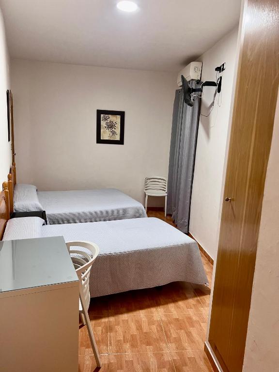 Postel nebo postele na pokoji v ubytování Hospederia del Pilar