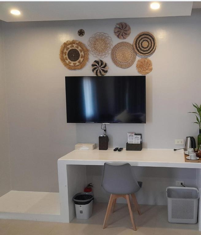 TV a/nebo společenská místnost v ubytování RC Villas and Resorts