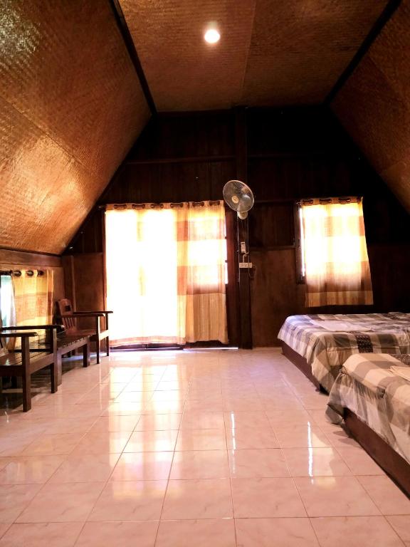 Postel nebo postele na pokoji v ubytování Pai Kiniman Resort