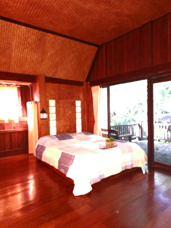 Postel nebo postele na pokoji v ubytování Pai Kiniman Resort