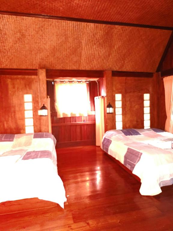 Postel nebo postele na pokoji v ubytování Pai Kiniman Resort