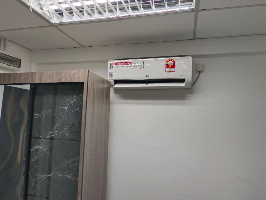 a room with a air conditioner in a ceiling at ROOMSTAY NIMAZA Bilik 2 in Marang
