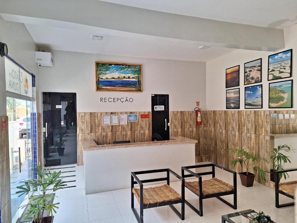 a store with two chairs in front of a counter at Canto da Duna Hotel in Barreirinhas