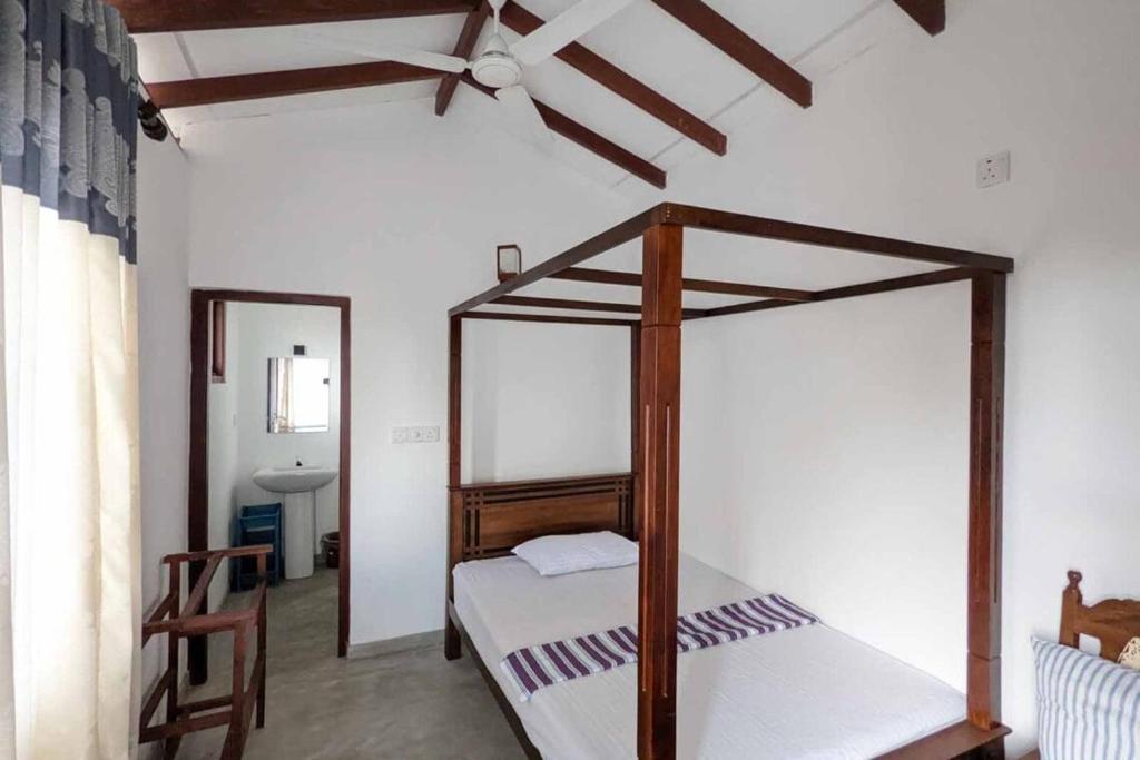 Postel nebo postele na pokoji v ubytování Villa Wismar Hikkaduwa