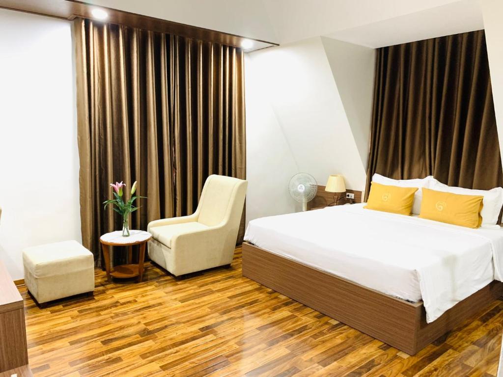 Postel nebo postele na pokoji v ubytování Green Hadong Hotel