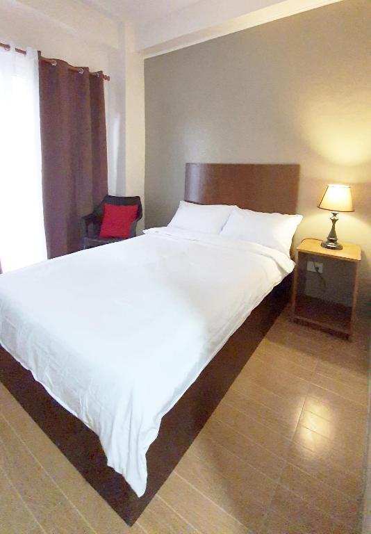 Postel nebo postele na pokoji v ubytování CASA LA EL BAGUIO