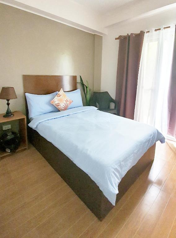 Postel nebo postele na pokoji v ubytování CASA LA EL BAGUIO