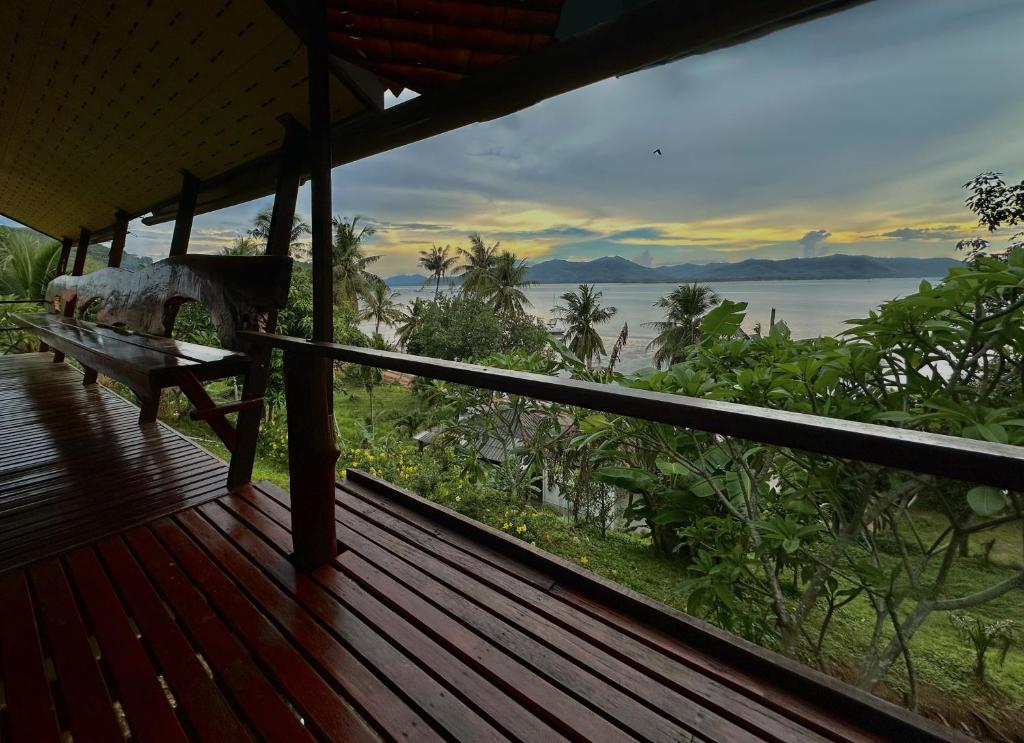 a porch of a house with a view of the ocean at Good View House - Koh Yao Noi in Ko Yao Noi