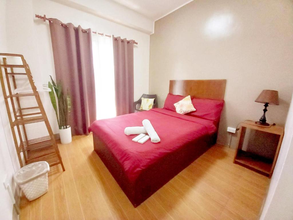 Postel nebo postele na pokoji v ubytování CASA LA EL BAGUIO