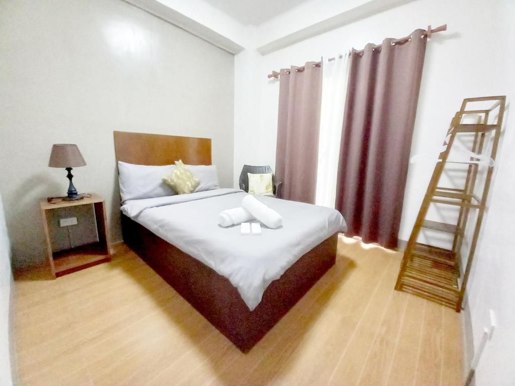 Postel nebo postele na pokoji v ubytování CASA LA EL BAGUIO