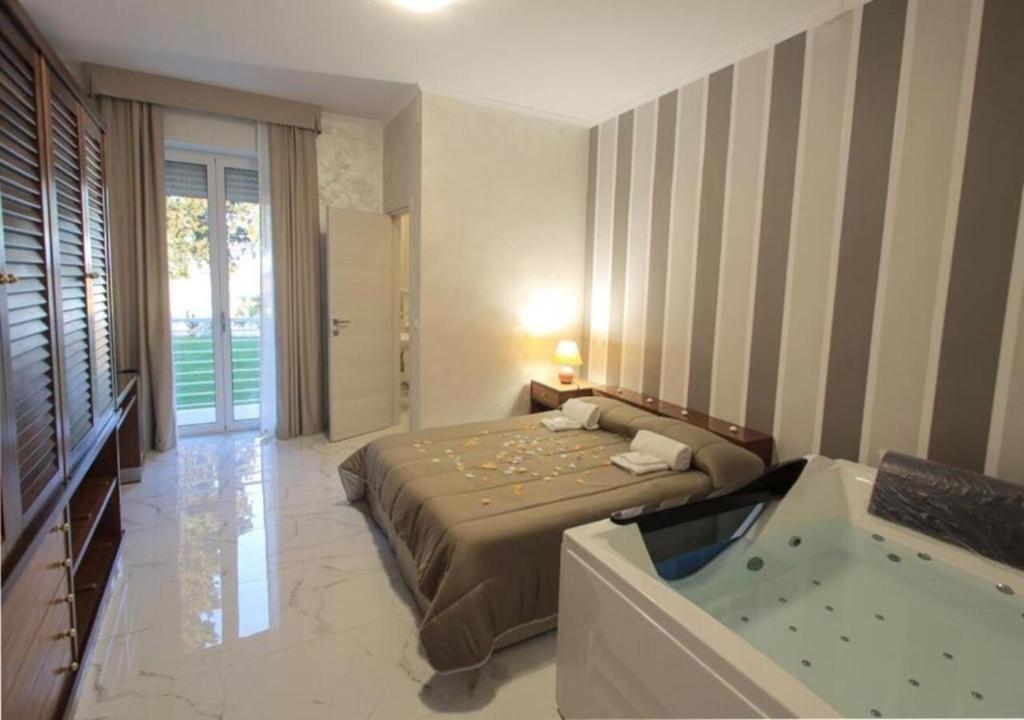 Postel nebo postele na pokoji v ubytování Hotel Holiday