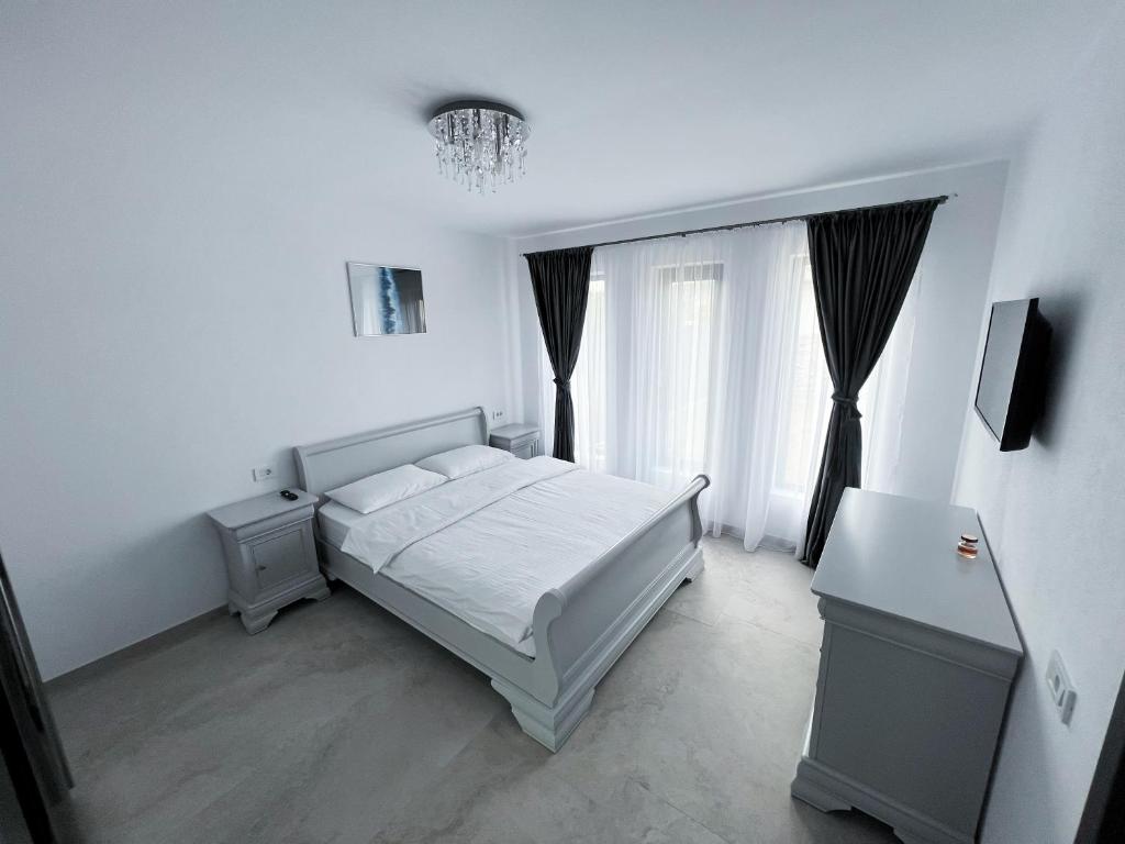 Postel nebo postele na pokoji v ubytování Casa Andreea