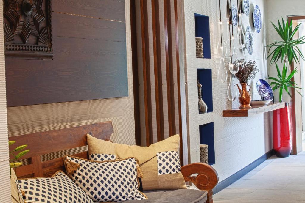 a living room with a couch with pillows on it at The Marmara Taksim in Istanbul