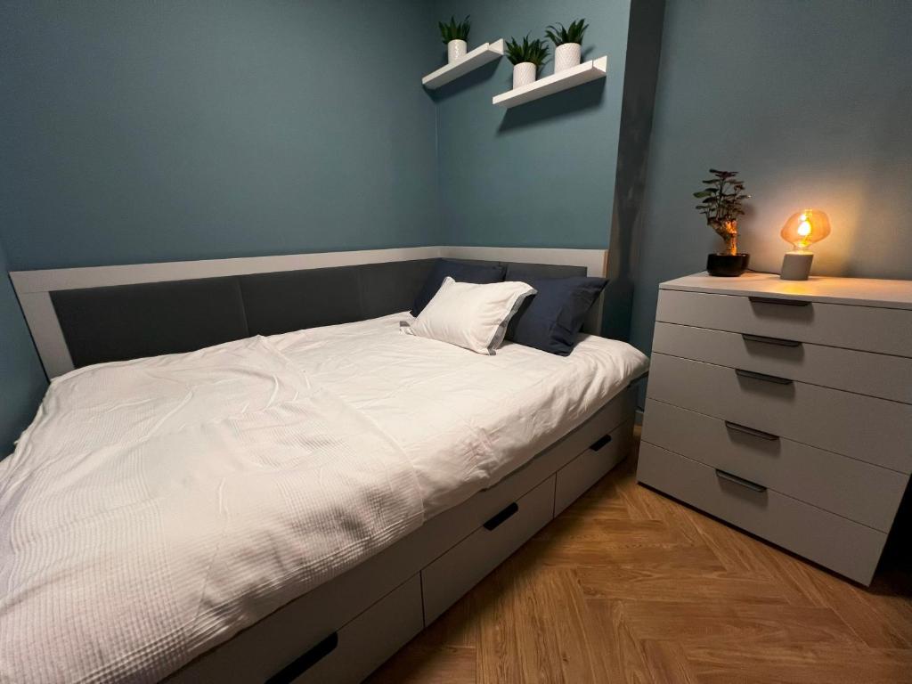 Кровать или кровати в номере Apartament Warszawska