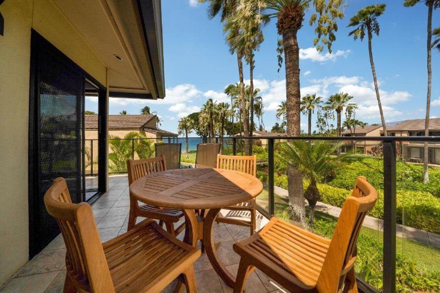 a patio with a table and chairs on a balcony at WAILEA ELUA, #1104 condo in Wailea