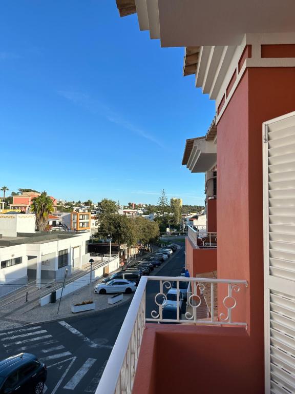 a balcony with a view of a street at Alvor Apartment in Alvor