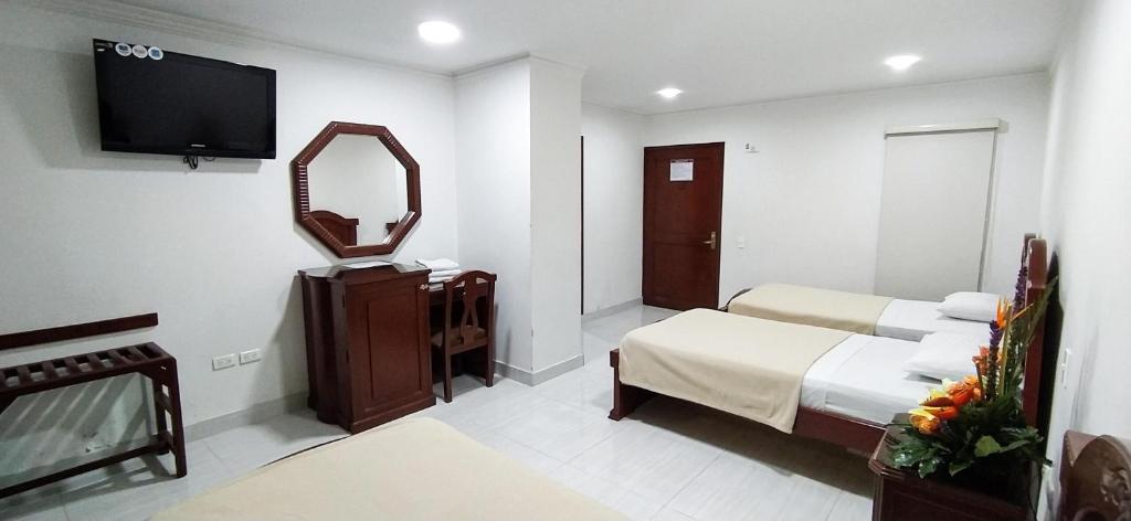 Postel nebo postele na pokoji v ubytování Hotel Exelsior