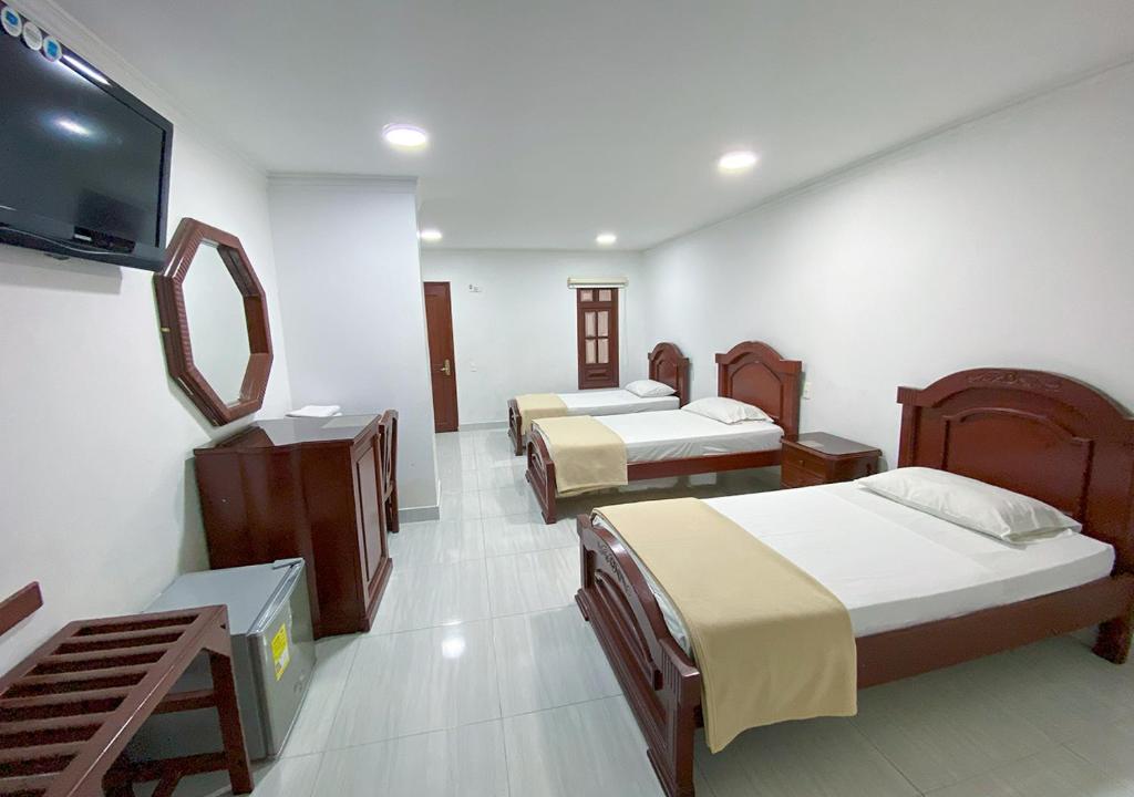 Postel nebo postele na pokoji v ubytování Hotel Exelsior