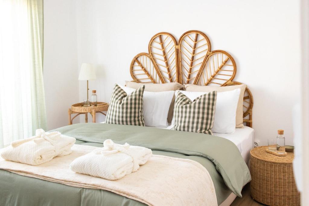 En eller flere senge i et værelse på Cegonha Branca Beach Flat