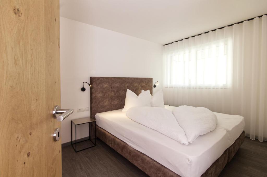 Postel nebo postele na pokoji v ubytování Pension & Residence Astoria