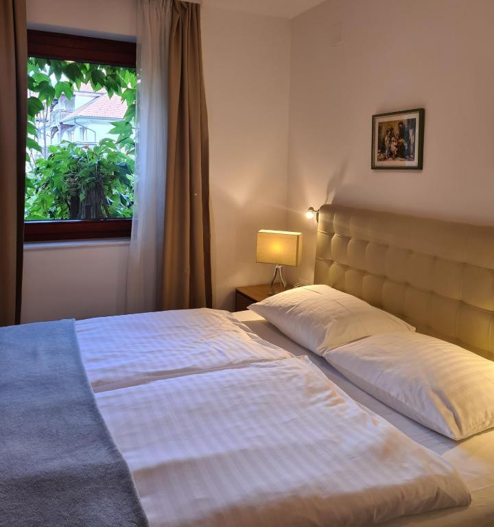 Postel nebo postele na pokoji v ubytování Aparthotel Gaja