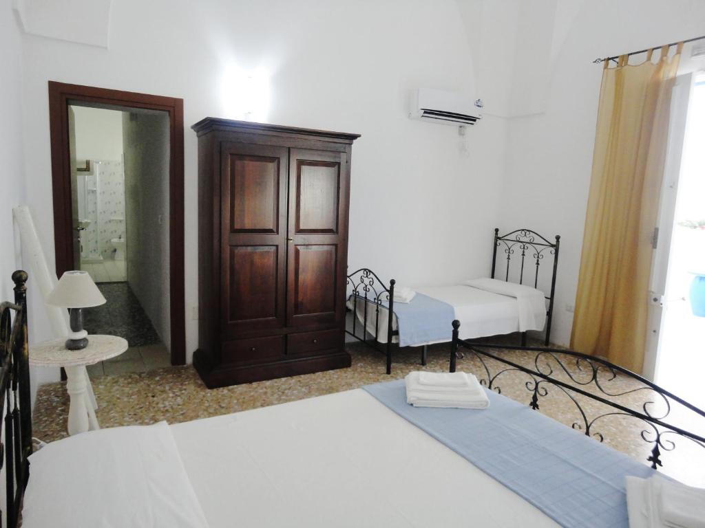 Postel nebo postele na pokoji v ubytování B&B Antiche Stelle Salento