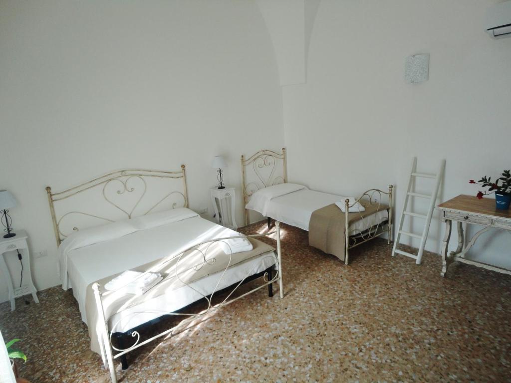 Postel nebo postele na pokoji v ubytování B&B Antiche Stelle Salento