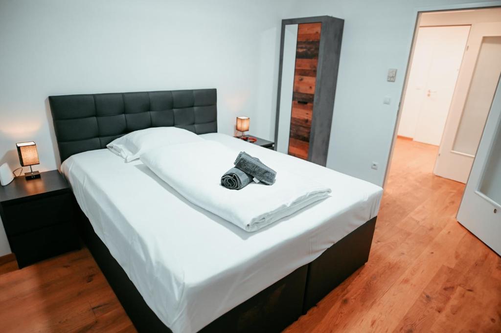מיטה או מיטות בחדר ב-Vienna Shopping Center 6a Apartment