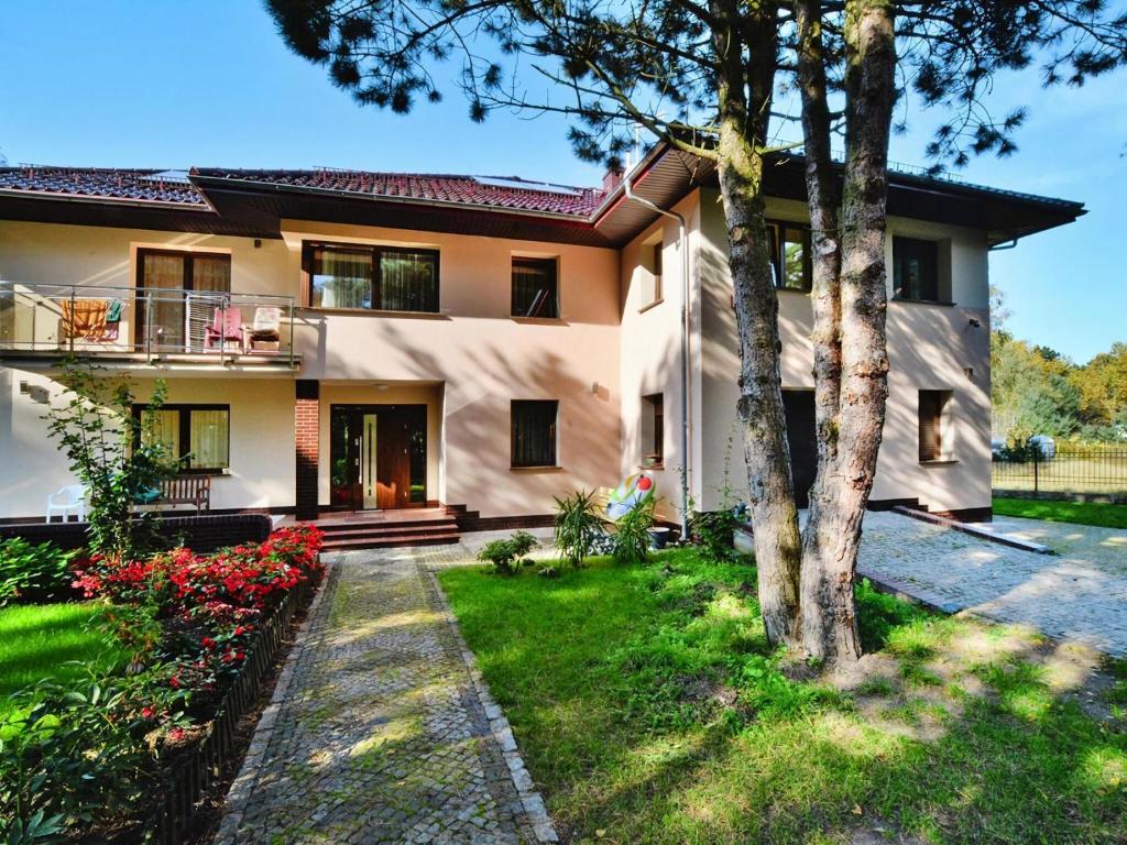 a house with a garden in front of it at Semi-detached house, Mielno in Mielno