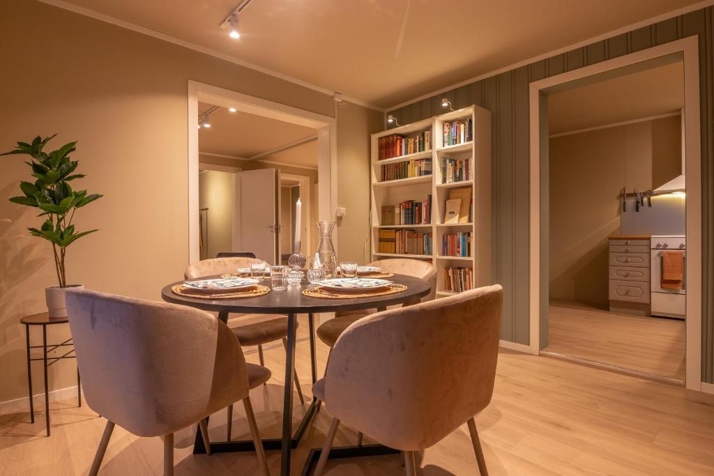 a dining room with a table and chairs at Cozy and spacious apartment in city centre in Tromsø