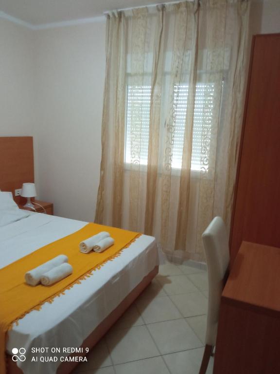 Postel nebo postele na pokoji v ubytování APARTMANI LUX SEA