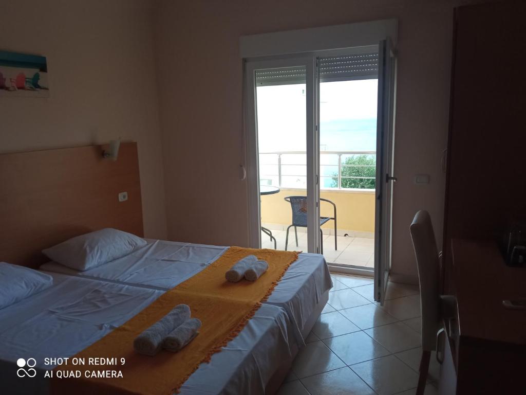 Postel nebo postele na pokoji v ubytování APARTMANI LUX SEA