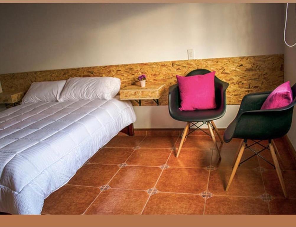 Voodi või voodid majutusasutuse New Hostel Usaquen Stanza toas