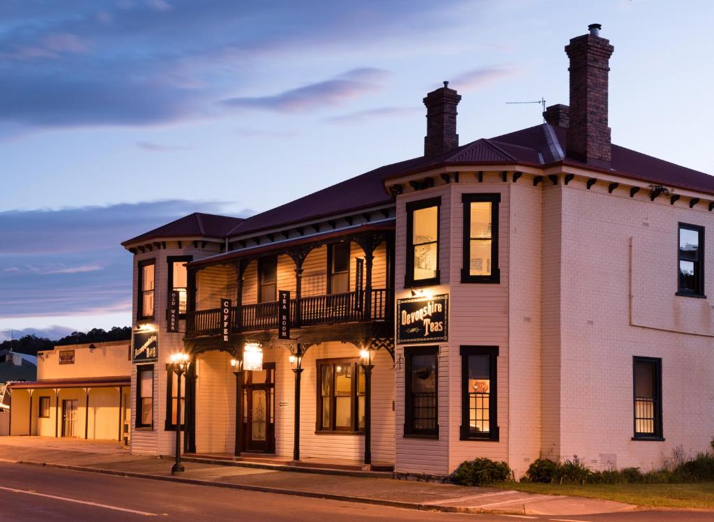 a building on the corner of a street at The Exchange Hotel - Offering Heritage Style Accommodation in Beaconsfield