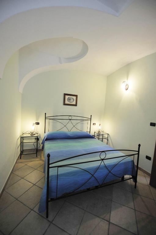 Postel nebo postele na pokoji v ubytování Agriturismo Isorella