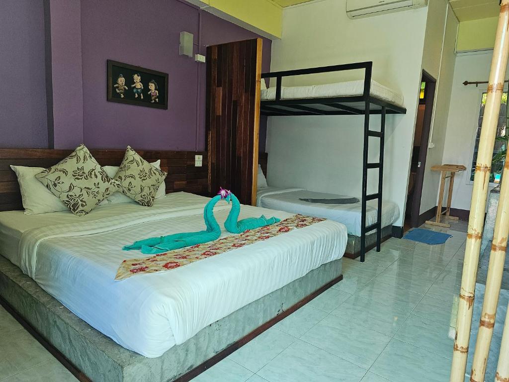 Postel nebo postele na pokoji v ubytování Cha-Cha Hotel