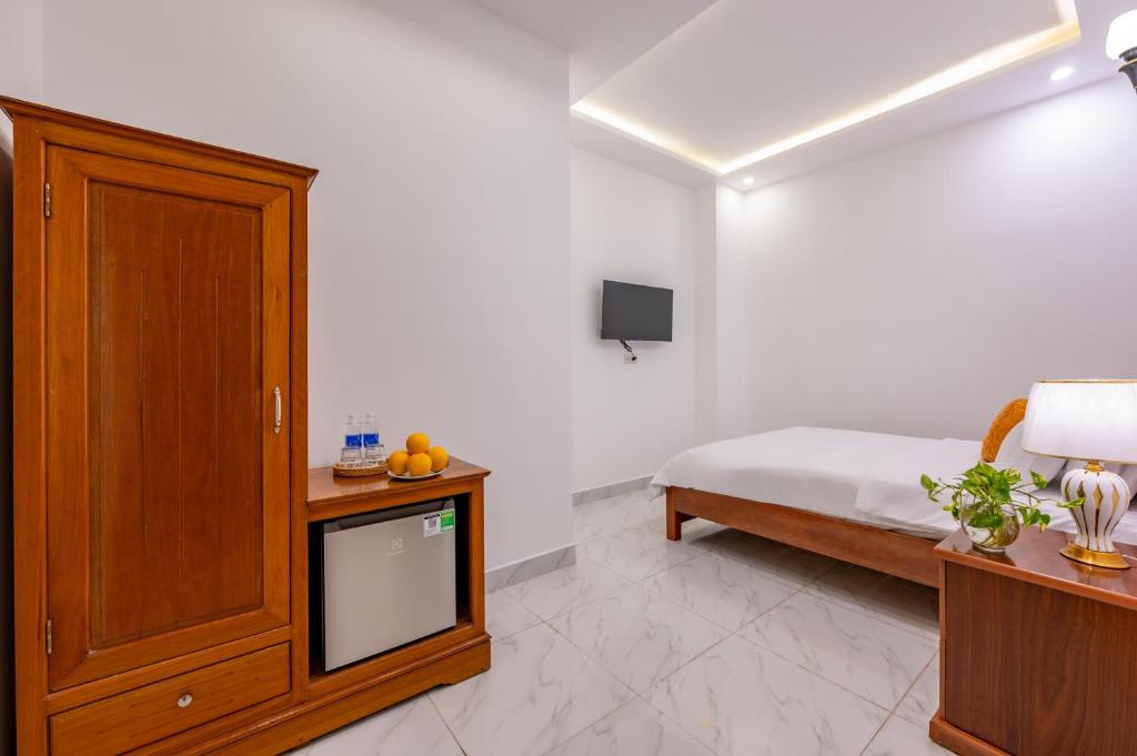 TV a/nebo společenská místnost v ubytování Golden Sun Hotel Hoi An