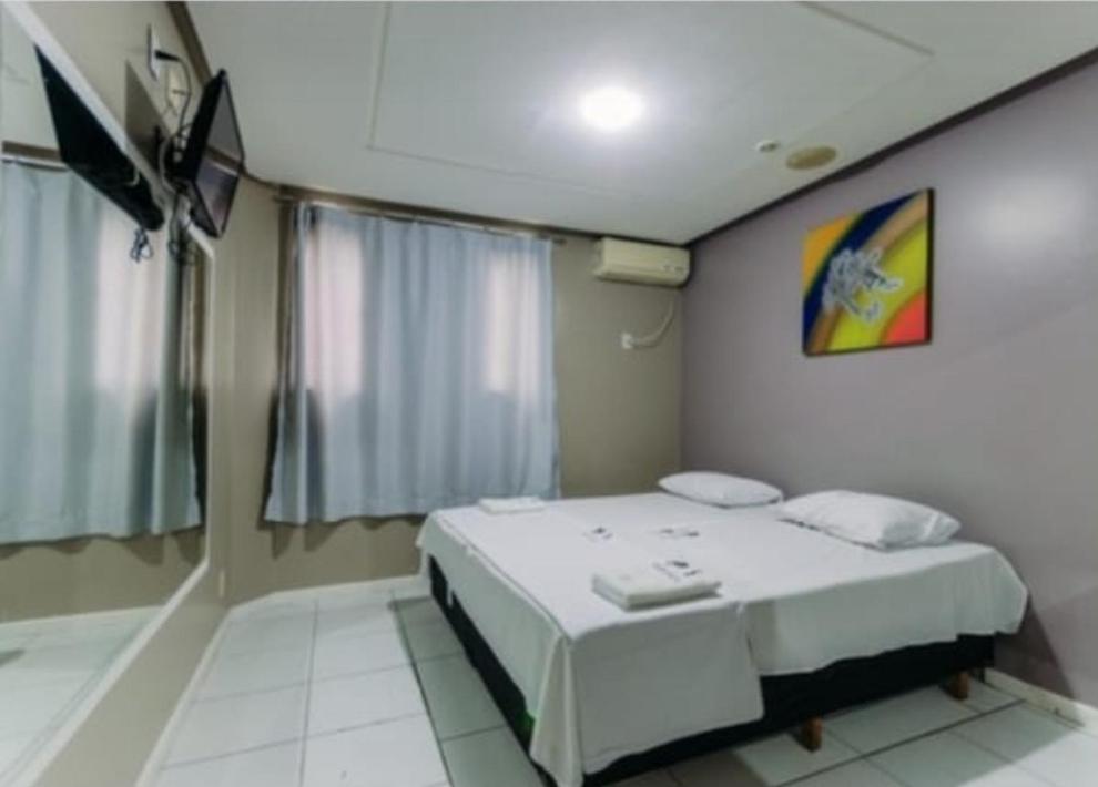 Postel nebo postele na pokoji v ubytování Iapi Hotel