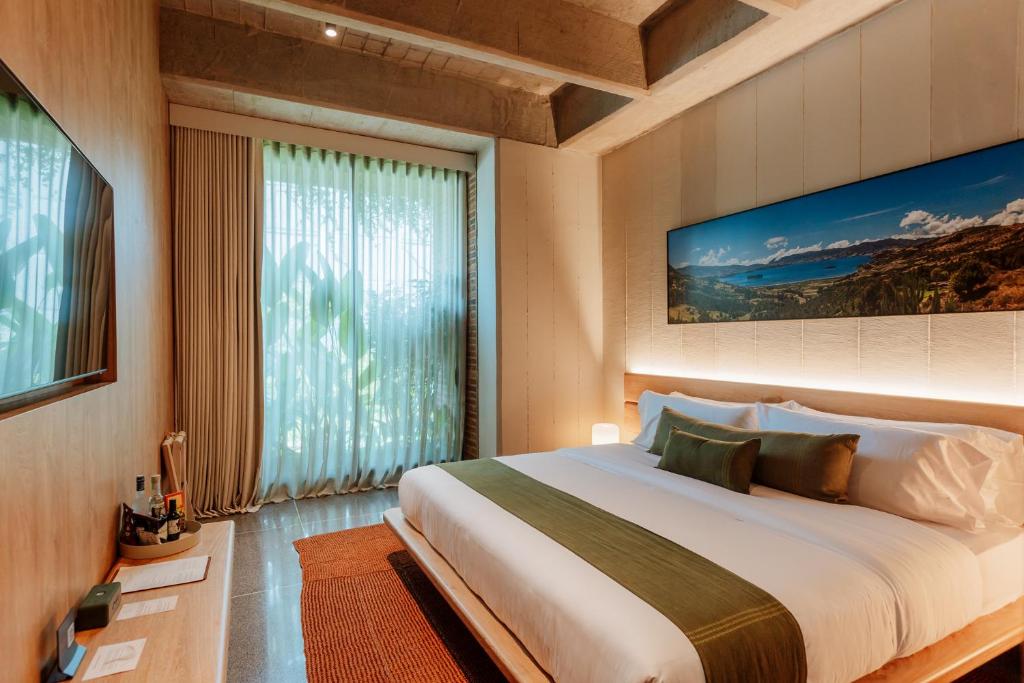 Postel nebo postele na pokoji v ubytování Hotel El Zarzo