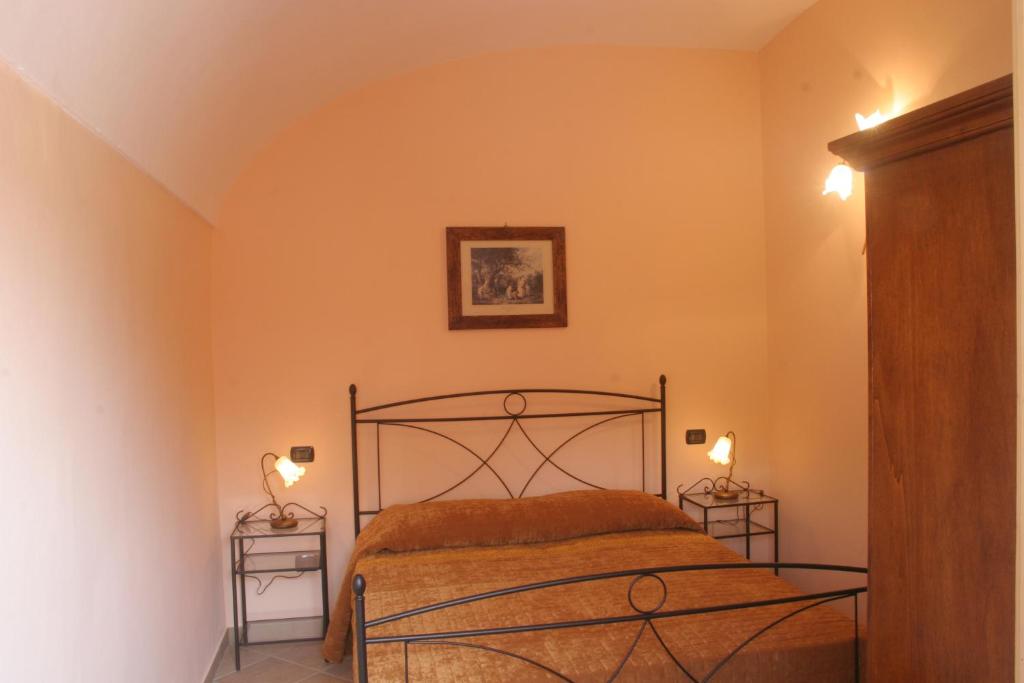 Postel nebo postele na pokoji v ubytování Agriturismo Isorella