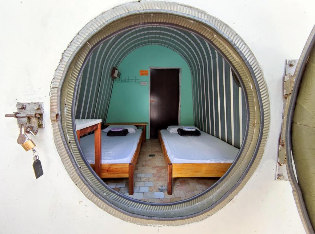 Postel nebo postele na pokoji v ubytování D' Limbai Cottage