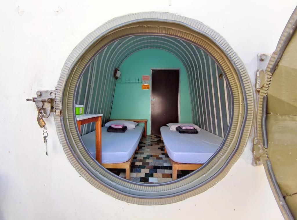 Postel nebo postele na pokoji v ubytování D' Limbai Cottage
