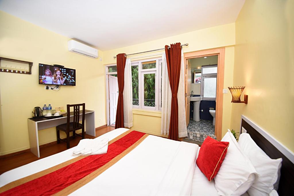 Postel nebo postele na pokoji v ubytování Hotel Odyssey Nepal