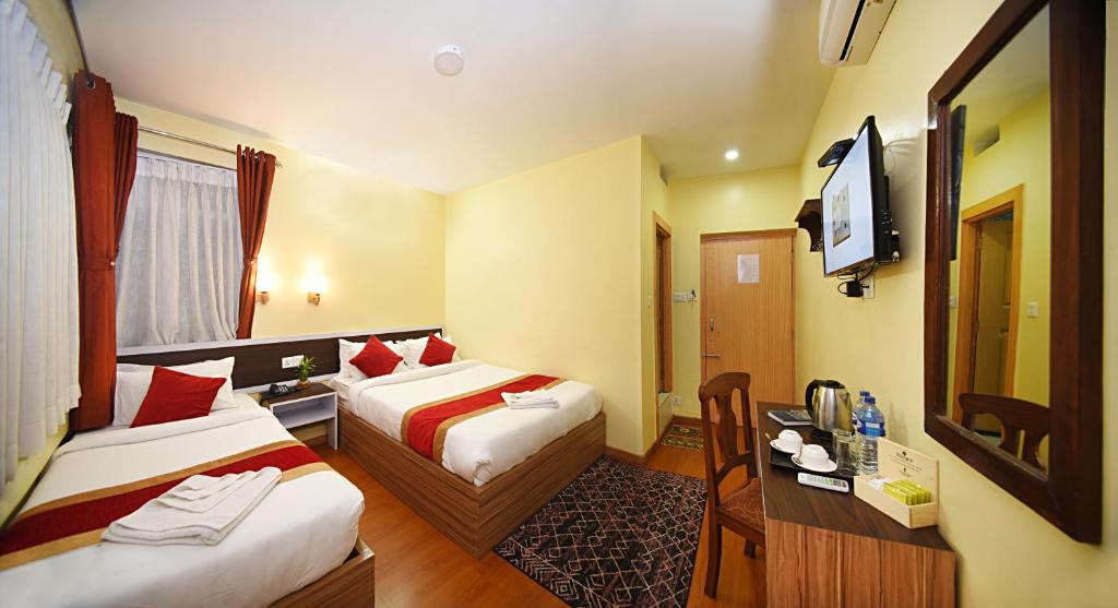 TV a/nebo společenská místnost v ubytování Hotel Odyssey Nepal