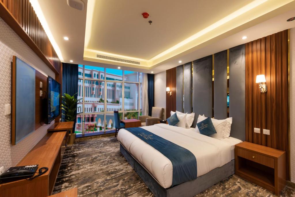 Postel nebo postele na pokoji v ubytování Paradise Inn Jeddah Hotel