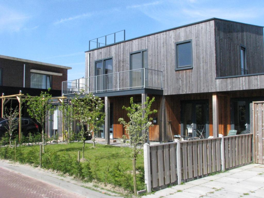 a house with a fence in front of it at Active BnB Den Haag in The Hague